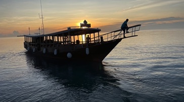 Dive boat at sunset